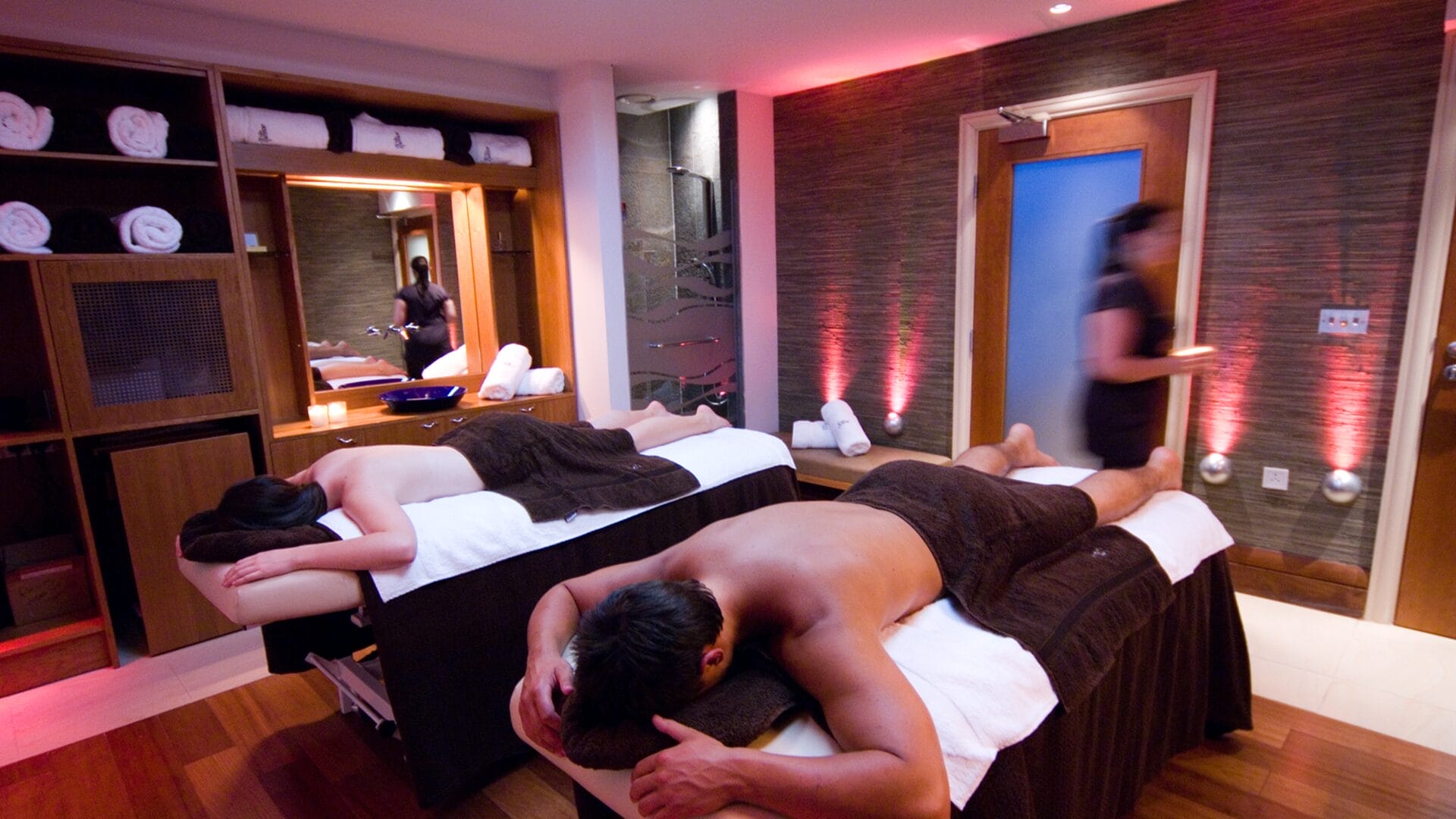 Two individuals getting spa treatment