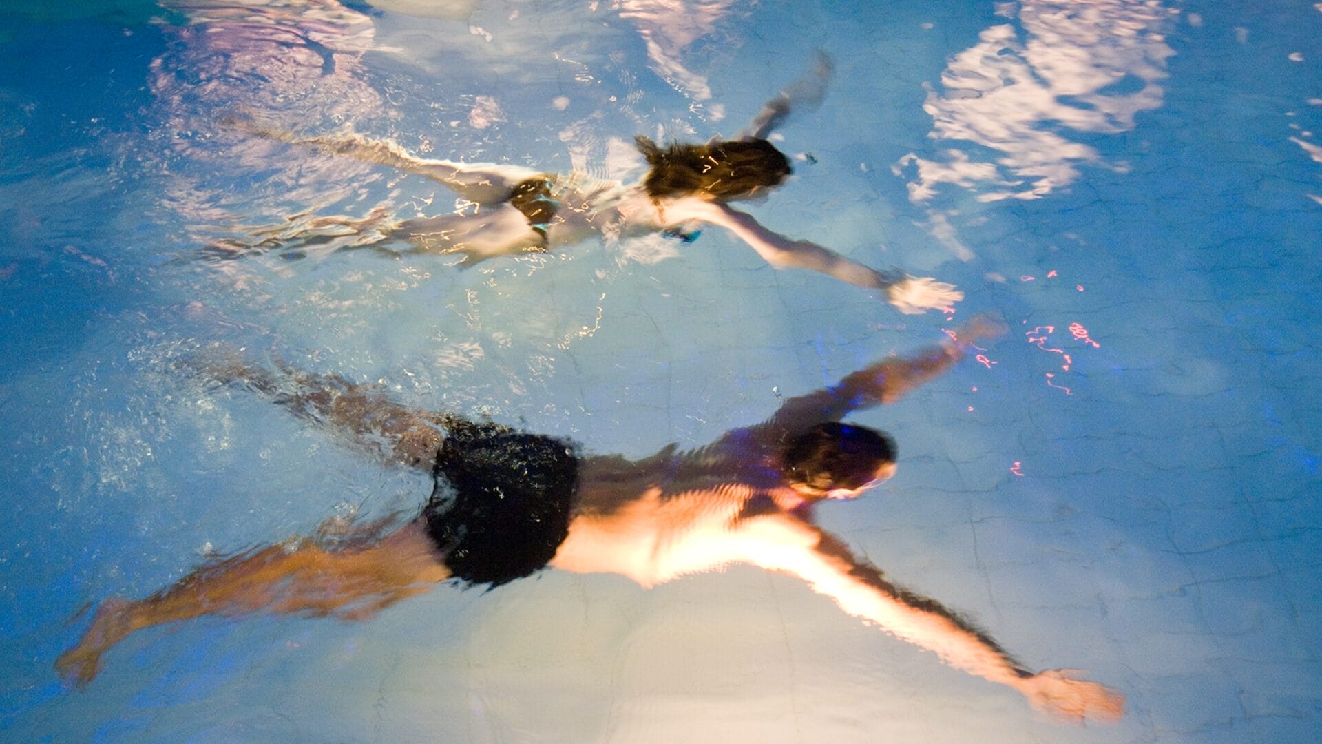 A couple relaxing in a pool