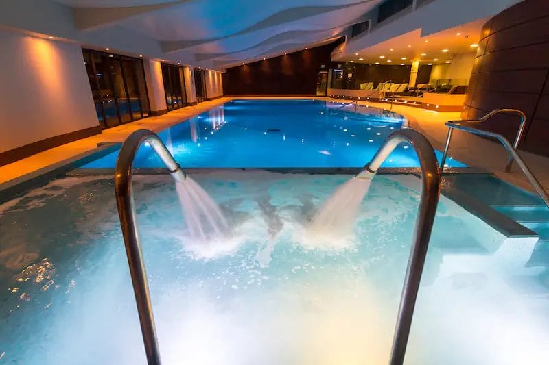 mere golf spa pool Two people sitting on a chair in a spa